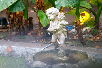 statue of a woman in a garden