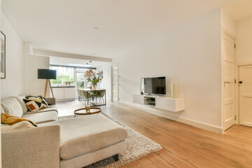 A stylish and contemporary living room showcasing elegant furniture and a warm palette. Perfect for relaxation and socializing in a comfortable atmosphere.