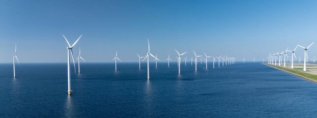 Vast offshore windmill park features numerous turbines harnessing wind energy in the North Sea, showcasing the Netherlands dedication to sustainable power.