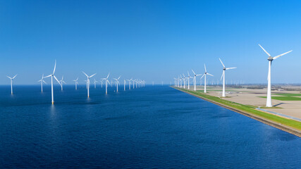 This expansive offshore windmill park features numerous wind turbines harnessing renewable energy...