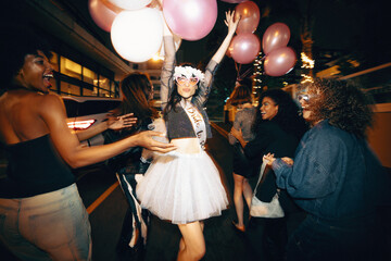 Group of young women celebrating a bachelorette party during a fun night out