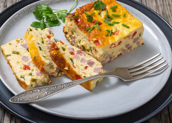 Baked Denver Omelette on a plate with fork
