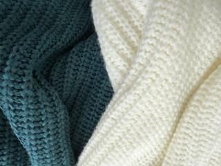 Soft knitted blankets in soothing textures and colors enhance cozy home atmosphere during winter evenings