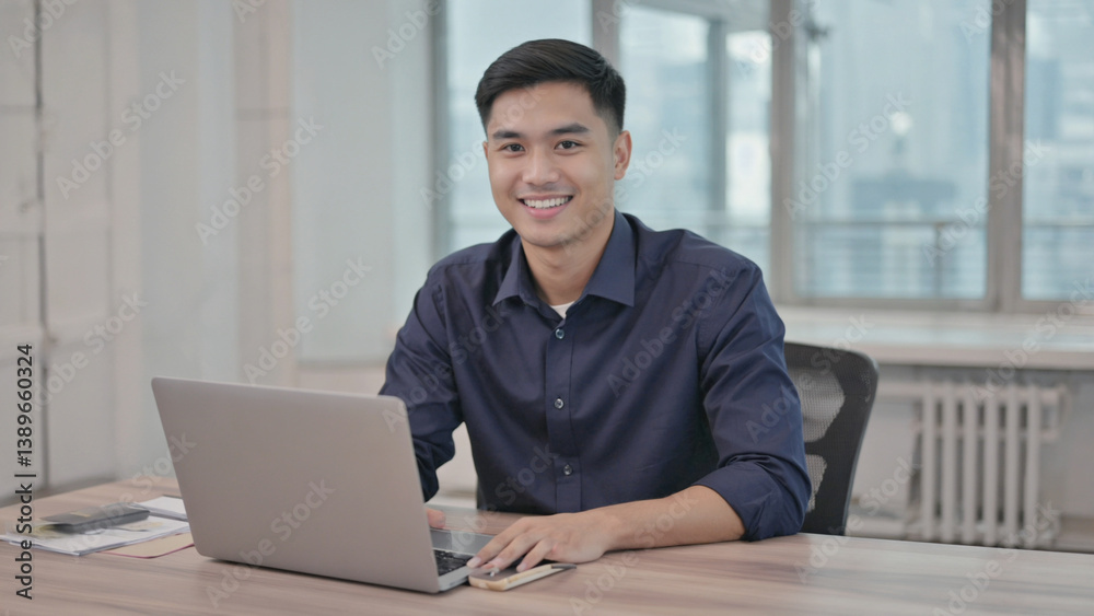 Poster A person working on their computer at a desk