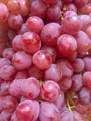 Piles of grapes for sale in a supermarket