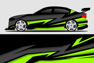 Sleek black sports car with vibrant green and gray racing stripes parked against a neutral backdrop