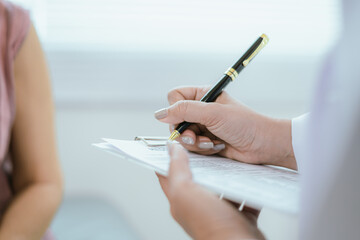 Doctor analyzes patient's blood test results and medication use on health screening concept chart.