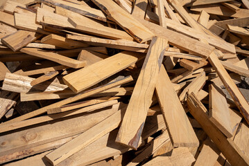 Timber piled on the ground for flooring, a random pile of wood.