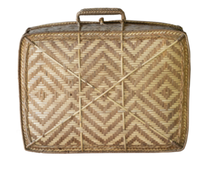 Old brown suitcase with a woven handle sits on transparent background.