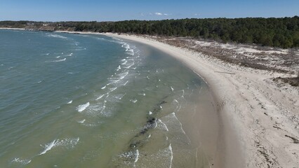 Coastal beach and surf of Chesapeake Bay in Virginia near Cape Charles