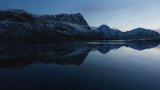 Panoramic view of a fjord at dusk in Norway. Nordic windless evening; Lofoten Islands, Northern Norway.