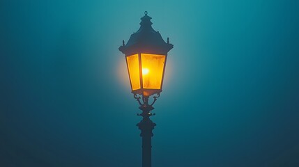  vintage lamppost glowing on a foggy night