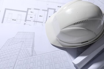 Hard hat on different engineering drawings, above view