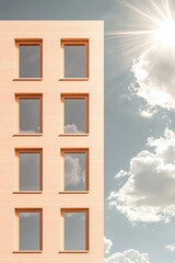Modern building facade with large windows under a sunny sky