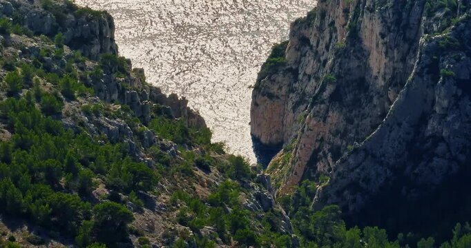 Aerial View of Calanque dEn-Vau near cassis town provence France. Breathtaking view of bay, a beautiful blue lagoon with a white sand beach, surrounded by cliffs, pines, near Marseille in France