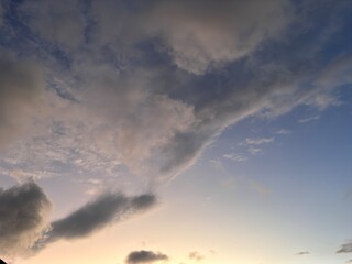 Beautiful sky with natural gradations. Thick clouds in the dusk sky on a winter night. Image of a cloudy sky in the afternoon. View of the night sky with golden light from the evening sun