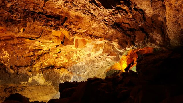 Lanzarote Spain 03 10 2025 Inside Cueva de los Verdes, Lanzarote, where tourists explore an ancient volcanic tunnel. Dramatic rock formations, dim lighting, and echoing sounds create a mysterious a