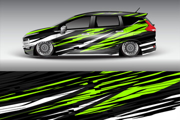 Obraz premium Stylishly wrapped car with vibrant green and black graphics showcasing dynamic design elements