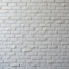 Fototapeta premium A textured white brick wall showcases a few patches of faded gray paint, creating an intriguing contrast. The bricks are unevenly arranged, adding character and depth to the surface.