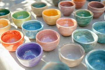 Handcrafted Clay CeramicWooden Bowls with Traditional Tribal Patterns Displayed in Oriental Market Bazaar, Generative AI