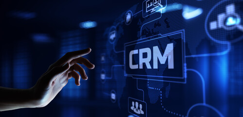 CRM Customer relationship management concept. Hand pressing button on screen.