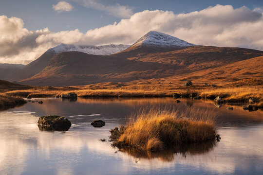 View of Lochan na h-Achlaise and the Black Mount, Rannoch Moor in evening light, Argyll and Bute, Highlands, Scotland, UK. November, 2023. 