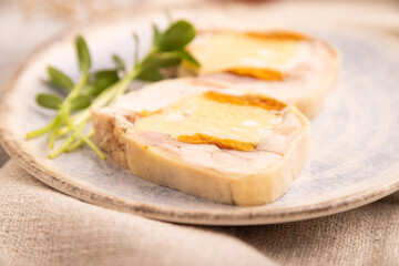 Chicken, egg and dried apricot meatloaf on brown concrete. Diet, healthy eating. side view, selective focus