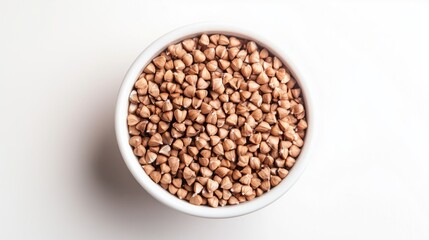 Raw Brown Buckwheat Groats in a White Bowl on a Clean White Background for Healthy Cooking