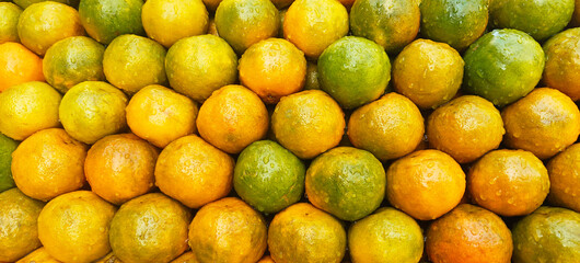 A pile of fresh oranges open sell in Indian market.