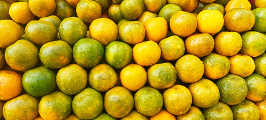 A pile of fresh oranges open sell in Indian market.