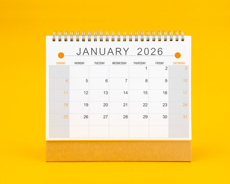 January 2026 desk calendar on yellow background, Front view.