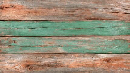 Obraz premium A textured wooden surface featuring weathered brown and green planks, showcasing natural variations and rustic charm.