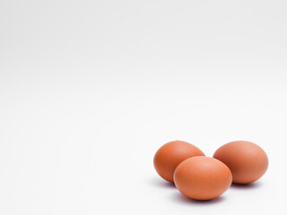 Fresh eggs on white background