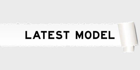 Ripped gray paper background that have word latest model under torn part