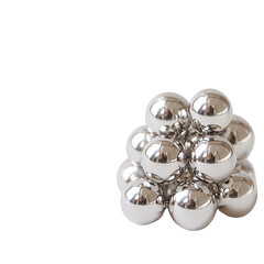 Shiny silver spheres arranged in a clustered formation.