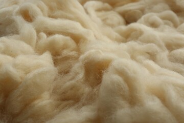Soft white wool texture as background, closeup