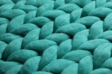 Turquoise knitted wool texture as background, closeup