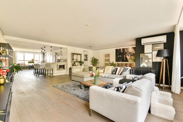 A stylish modern living room featuring elegant furniture, contemporary decor, and a cozy ambiance, perfect for relaxation and social gatherings.