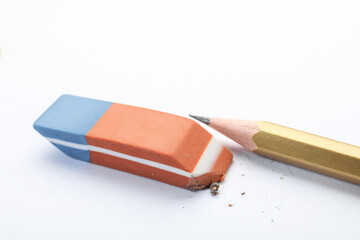 Eraser and pencil on white background, closeup