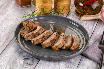 Roasted duck breast slices in the plate