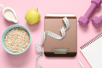 Electronic kitchen scale, measuring tape, dumbbells, notepad and products on pink background, flat lay. Diet
