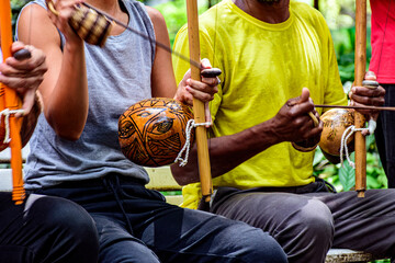 Berimbau players in capoeira performance in Brazil