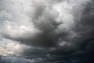 Dramatic dark storm thundercloud rain clouds on black sky background. Dark thunderstorm clouds rainny landscape. Meteorology danger windstorm disaster climate. Dark cloudscape storm disaster gray sky