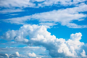 Blue sky fluffy white clouds on summer season bright clear skyline with beautiful cloudscape. Panorama blue sky clouds pattern on daylight with copy space. Cumulus cloudscape air climate sunny day © aFotostock