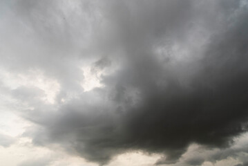 Dramatic dark storm thundercloud rain clouds on black sky background. Dark thunderstorm clouds rainny landscape. Meteorology danger windstorm disaster climate. Dark cloudscape storm disaster gray sky