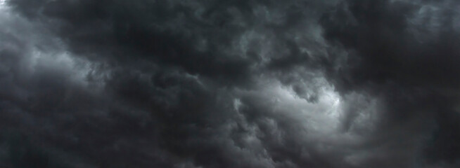 Banner Dramatic dark storm clouds black sky background. Dark thunderstorm clouds rainny season....