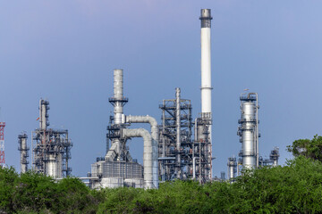 Oil and gas refinery industrial factory plant with blue sky background at oil and gas refinery zone, Business oil and gas industrial plant, Oil and gas refinery petrochemical plant industrial.