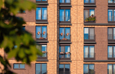 Fototapeta premium Modern buildings, walls and windows. City view on a sunny day. 