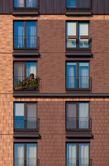 Fototapeta premium Modern buildings, walls and windows. City view on a sunny day. 