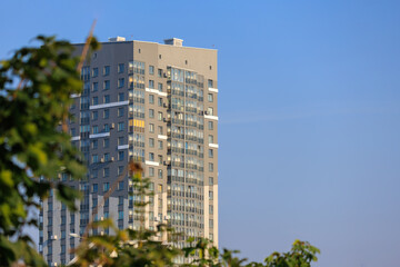 City view on a sunny day. Modern buildings, walls and windows. 